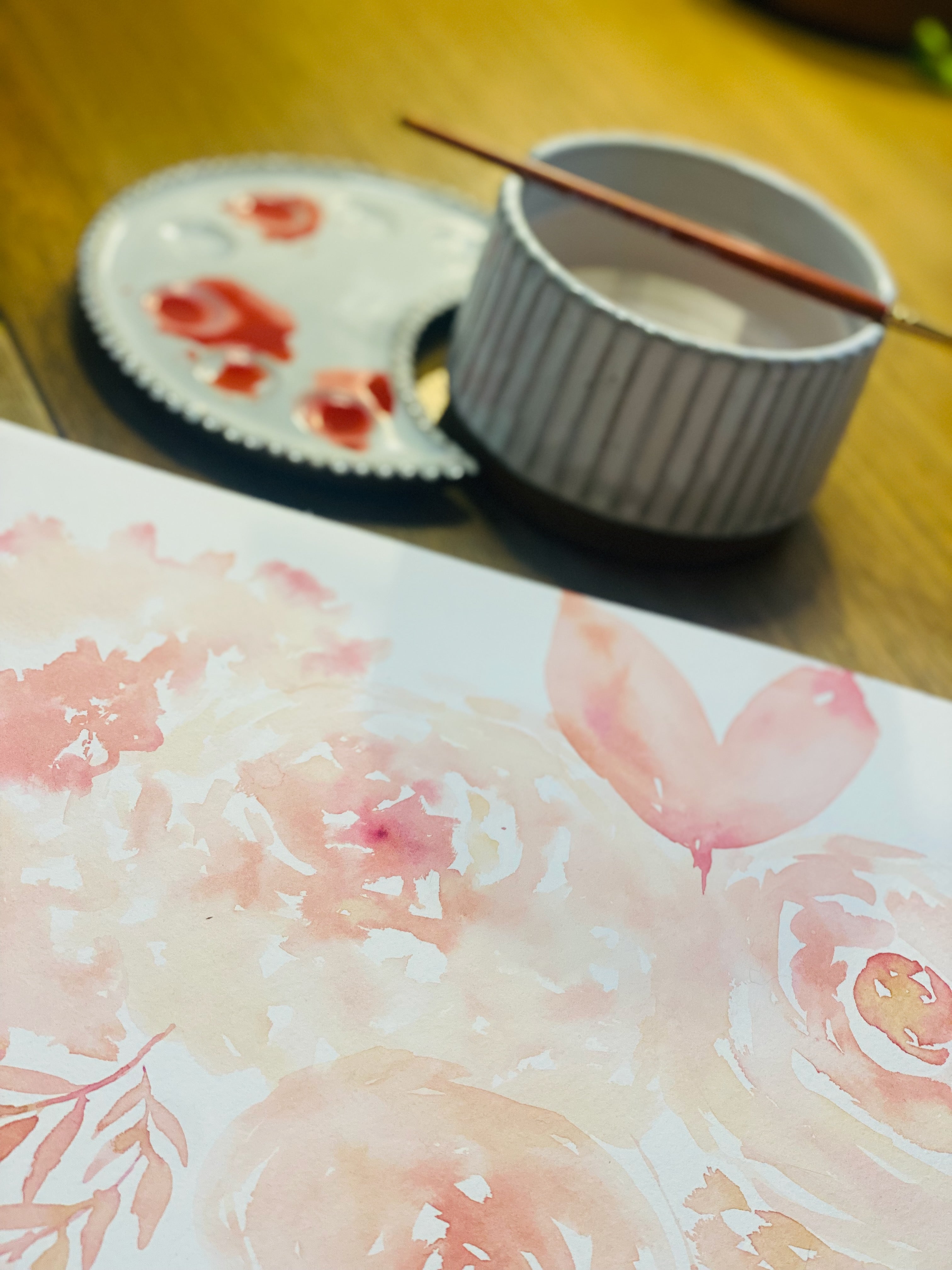 Watercolor painting process with pink botanical artwork and artist tools – Shirley Browning Studio