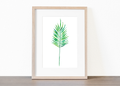 Watercolor palm leaf in soft green and turquoise tones on a clean white background.